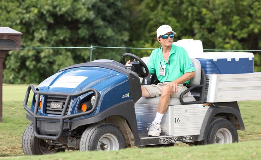 volunteer in golf cart