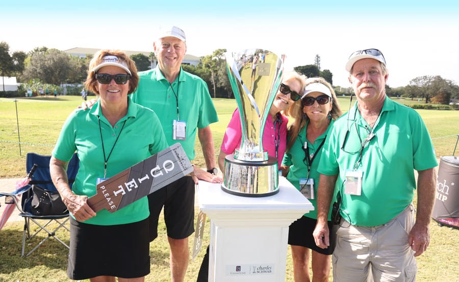 volunteers with trophy