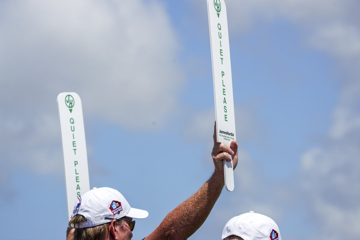 volunteer holding quiet signs